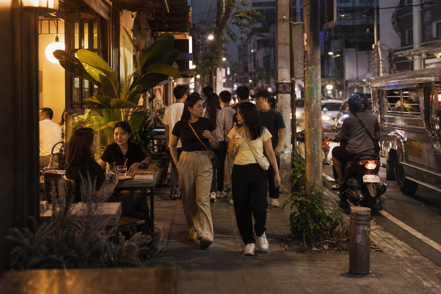 People gathering outdoors in a Philippine neighborhood at golden hour
